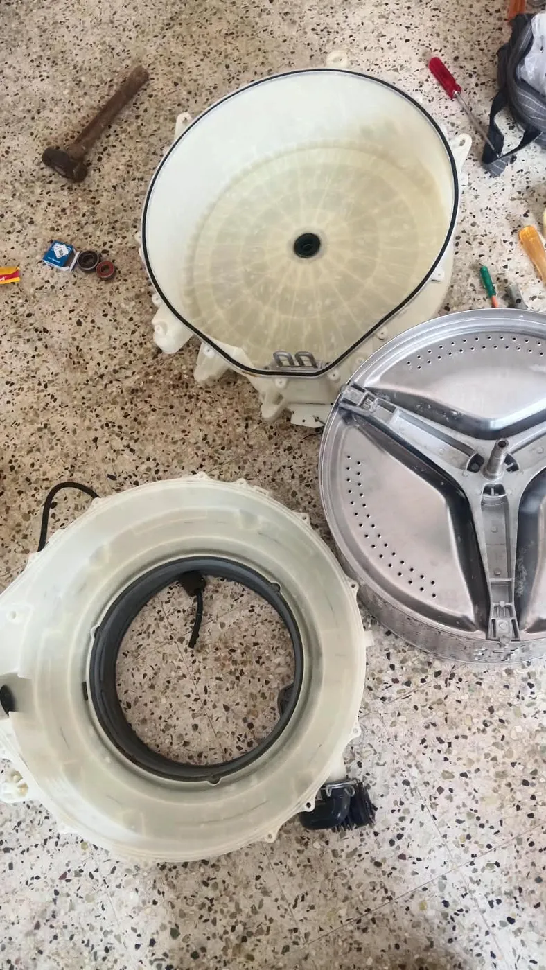 Washing machine drum and tub assembly removed for servicing